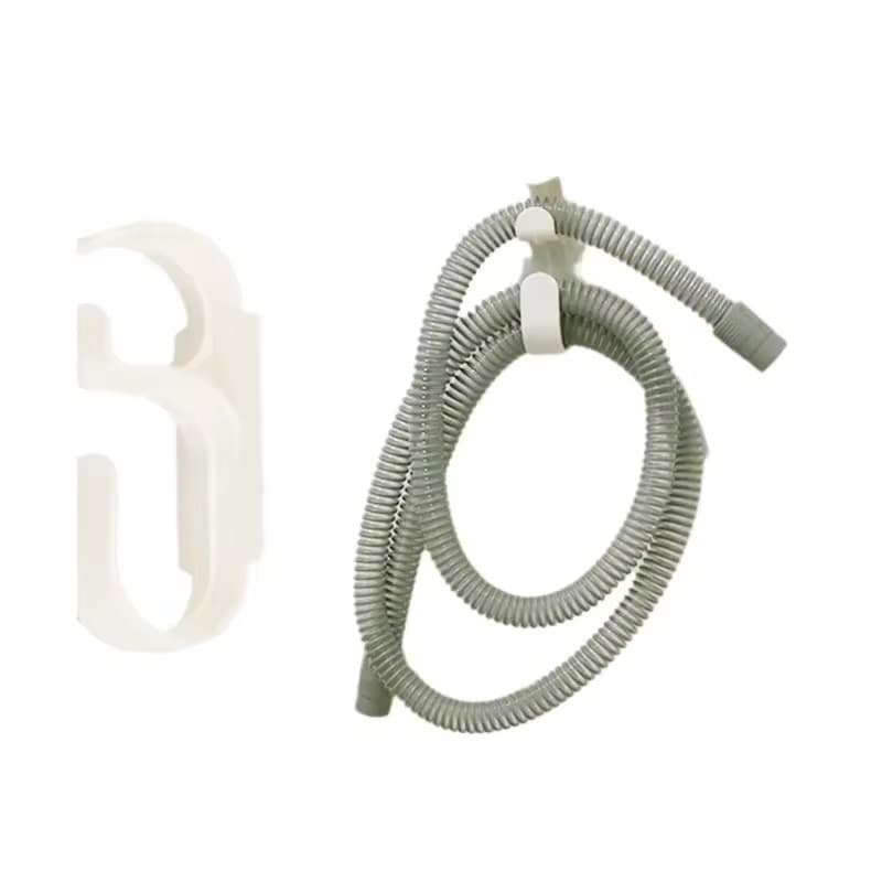 TangleRest holder with adhesive mounting pad